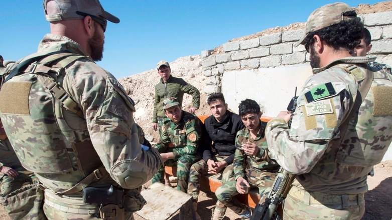 Canadian soldiers speak to Kurdistan Region Peshmerga forces on of the frontlines against ISIS, Feb. 20, 2017. (Photo: Ryan Remiorz/The Canadian Press/AP)
